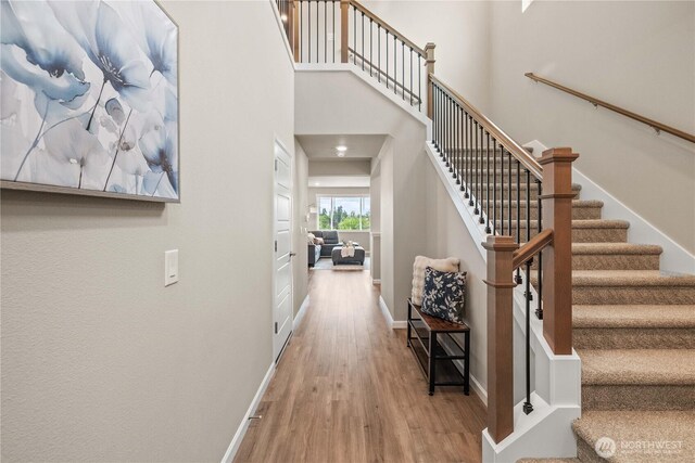 25701 204th Pl SE, Covington, WA 98042 - staircase featuring wood finished floors and baseboards