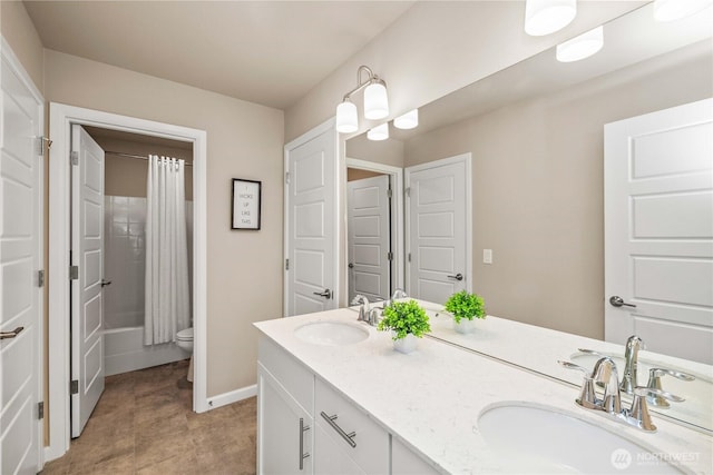 25701 204th Pl SE, Covington, WA 98042 - bathroom with double vanity, toilet, baseboards, and shower / tub combo