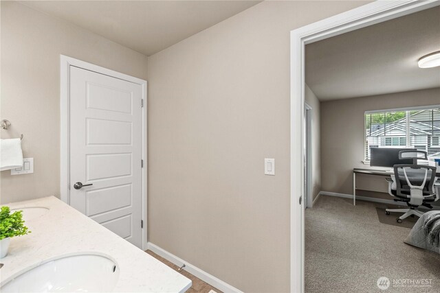 25701 204th Pl SE, Covington, WA 98042 - bathroom featuring double vanity and baseboards