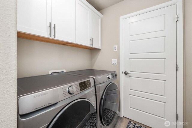 25701 204th Pl SE, Covington, WA 98042 - laundry room with cabinet space and separate washer and dryer