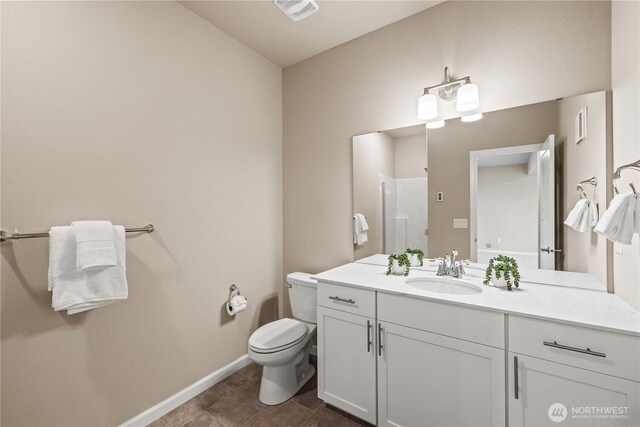25701 204th Pl SE, Covington, WA 98042 - bathroom featuring vanity, toilet, baseboards, and tile patterned floors