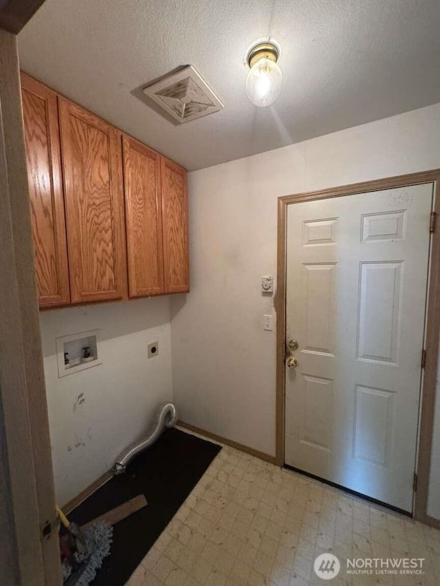 368 Snahapish Ave SE, Ocean Shores, WA 98569 - laundry room featuring light flooring, cabinet space, washer hookup, a textured ceiling, and hookup for an electric dryer