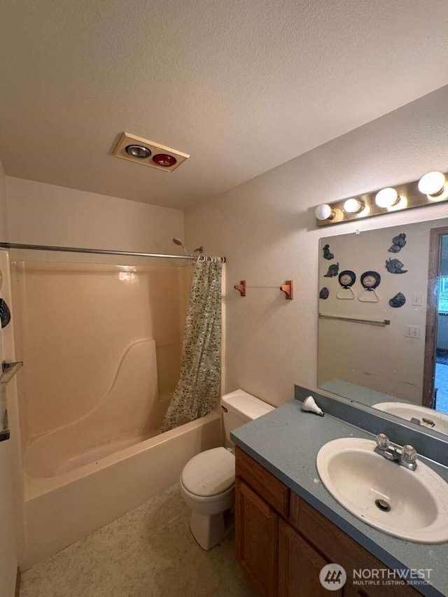 368 Snahapish Ave SE, Ocean Shores, WA 98569 - bathroom with shower / bath combo with shower curtain, toilet, vanity, and a textured ceiling