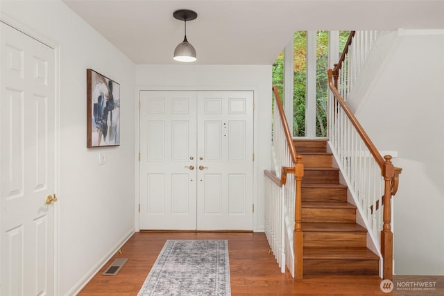 16822 SE 26th St, Bellevue, WA 98008 - foyer featuring wood finished floors, stairway, and baseboards