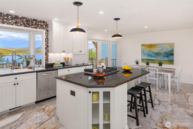 16822 SE 26th St, Bellevue, WA 98008 - kitchen featuring stainless steel appliances, a sink, light marble finish flooring, plenty of natural light, and recessed lighting