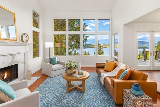 16822 SE 26th St, Bellevue, WA 98008 - sunroom featuring plenty of natural light, vaulted ceiling, a water view, and french doors
