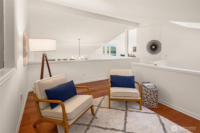 16822 SE 26th St, Bellevue, WA 98008 - sitting room with wood finished floors, baseboards, and a chandelier