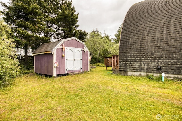 568 Cowlitz Ct SW, Ocean Shores, WA 98569 - view of grassy yard featuring a wooden deck