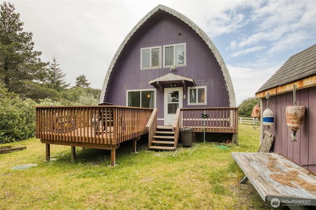 568 Cowlitz Ct SW, Ocean Shores, WA 98569 - back of property with a lawn and a deck