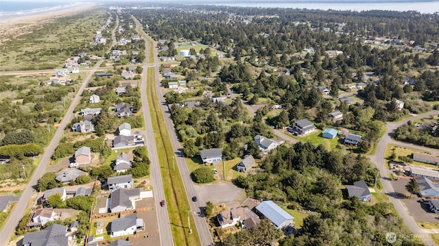 568 Cowlitz Ct SW, Ocean Shores, WA 98569 - aerial view of property and surrounding area featuring nearby suburban area