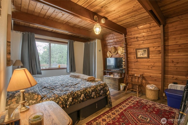 568 Cowlitz Ct SW, Ocean Shores, WA 98569 - bedroom featuring wood ceiling with exposed beams, wooden walls, and wood finished floors
