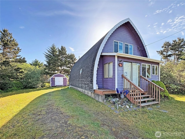 568 Cowlitz Ct SW, Ocean Shores, WA 98569 - view of front of property featuring a gambrel roof, a front lawn, and entry steps