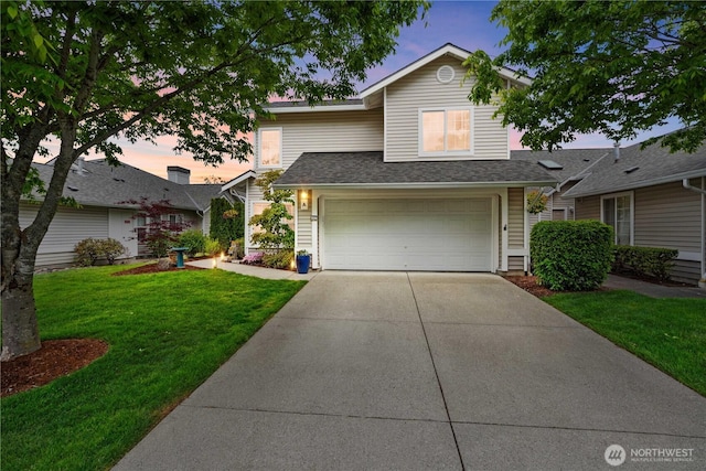 1317 60th St SE Unit A, Auburn, WA 98092 - traditional-style house featuring concrete driveway, an attached garage, a front yard, and roof with shingles