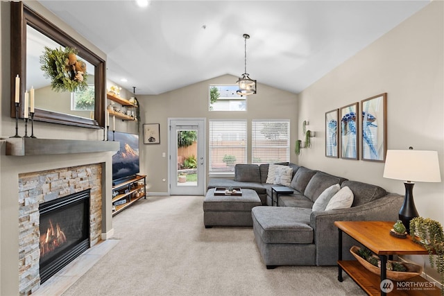 1317 60th St SE Unit A, Auburn, WA 98092 - carpeted living room with vaulted ceiling, a stone fireplace, recessed lighting, and baseboards