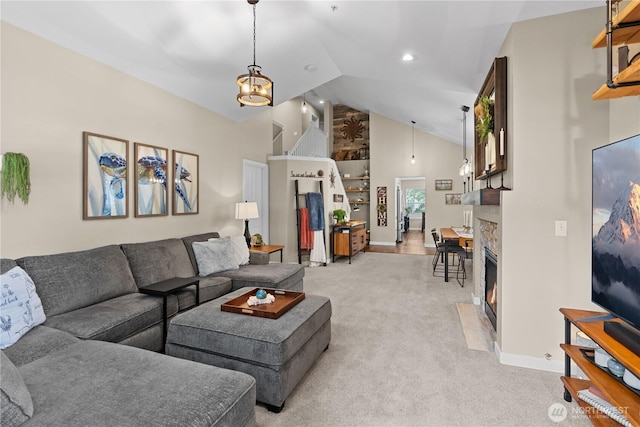 1317 60th St SE Unit A, Auburn, WA 98092 - living area featuring high vaulted ceiling, light colored carpet, a fireplace with flush hearth, and baseboards