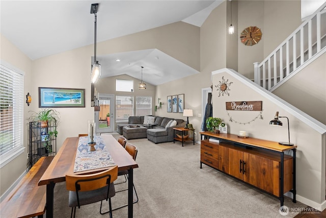 1317 60th St SE Unit A, Auburn, WA 98092 - dining space with stairway, carpet floors, high vaulted ceiling, and baseboards