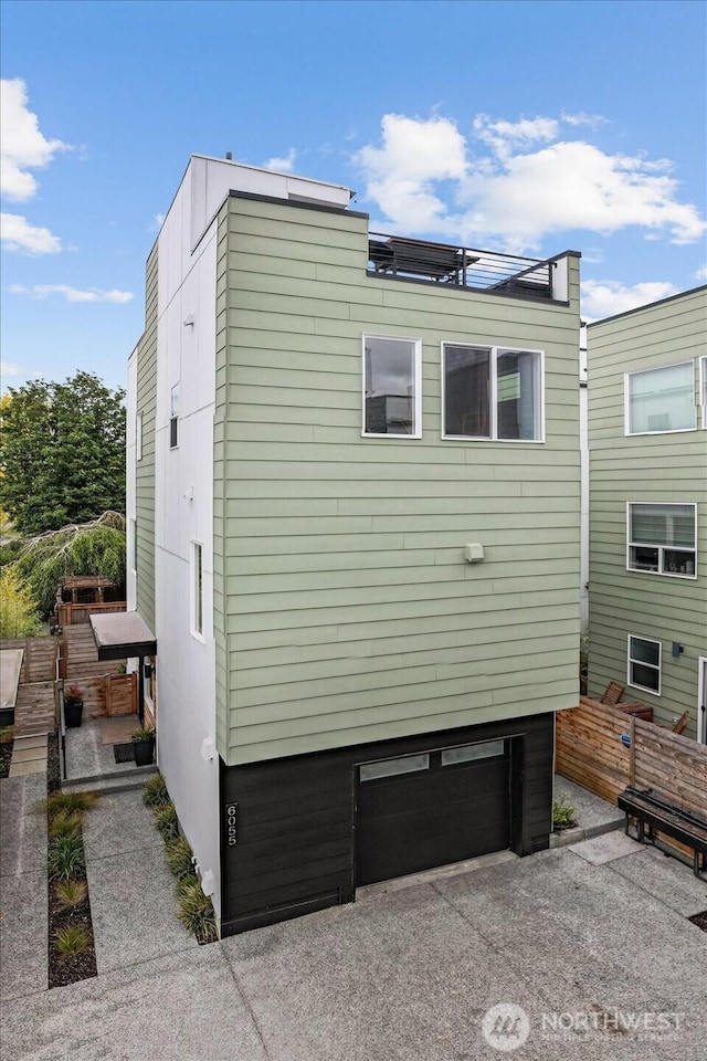 6055 7th Ave NW, Seattle, WA 98107 - view of property exterior with a garage