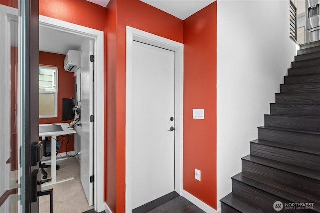 6055 7th Ave NW, Seattle, WA 98107 - entrance foyer featuring a wall mounted AC, stairway, and baseboards