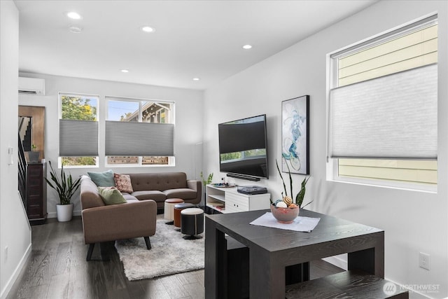6055 7th Ave NW, Seattle, WA 98107 - living room with a wall unit AC, healthy amount of natural light, wood finished floors, and recessed lighting