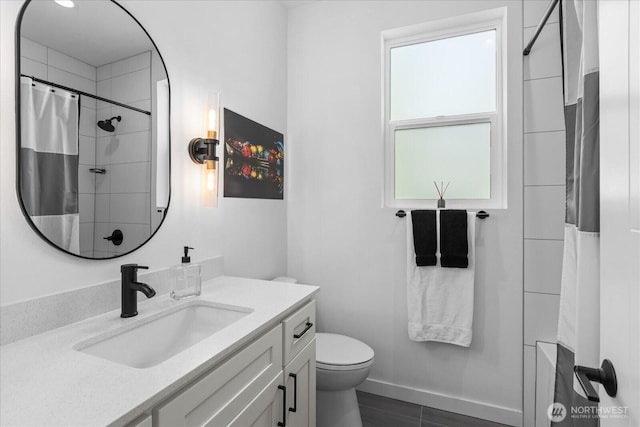 6055 7th Ave NW, Seattle, WA 98107 - full bathroom with vanity, toilet, a shower with shower curtain, and baseboards
