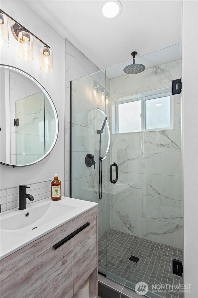 6055 7th Ave NW, Seattle, WA 98107 - bathroom with a marble finish shower and vanity