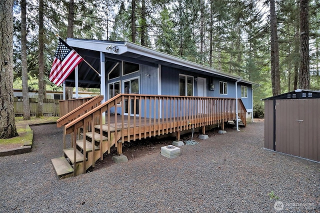201 E Sleaford Rd, Shelton, WA 98584 - view of front of house featuring a deck and view of wooded area
