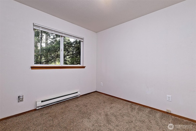 201 E Sleaford Rd, Shelton, WA 98584 - carpeted empty room featuring baseboard heating and baseboards