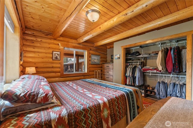 21 Oakes Dr, Tonasket, WA 98855 - bedroom with rustic walls, a wood ceiling with exposed beams, and a closet