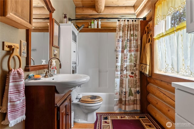 21 Oakes Dr, Tonasket, WA 98855 - bathroom featuring log walls, vanity, and shower / tub combo with curtain