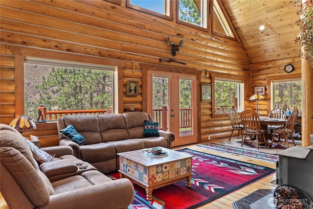 21 Oakes Dr, Tonasket, WA 98855 - living room with high vaulted ceiling, french doors, hardwood / wood-style flooring, rustic walls, and healthy amount of natural light