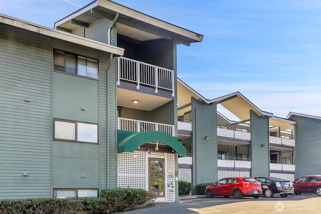 7924 SW 212th St Unit 211, Edmonds, WA 98026 - view of property featuring uncovered parking
