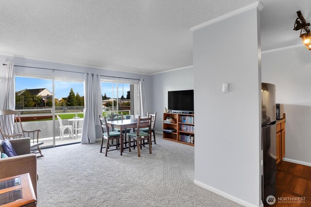 7924 SW 212th St Unit 211, Edmonds, WA 98026 - carpeted dining area with a textured ceiling and ornamental molding