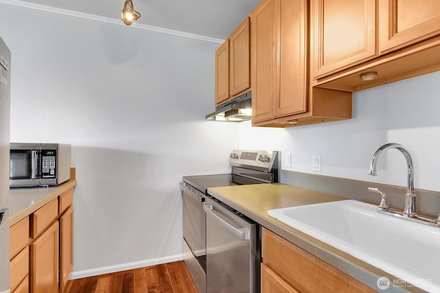 7924 SW 212th St Unit 211, Edmonds, WA 98026 - kitchen with a sink, under cabinet range hood, stainless steel appliances, dark wood-style flooring, and light countertops