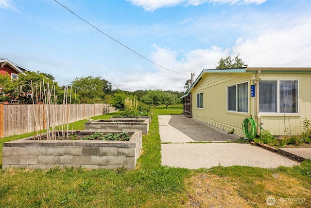 1405 226th St NW, Silvana, WA 98287 - view of yard with a vegetable garden and a patio area