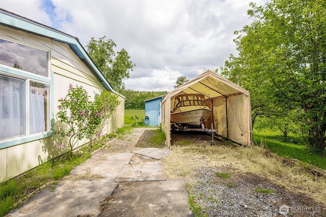 1405 226th St NW, Silvana, WA 98287 - view of yard with a detached carport and driveway