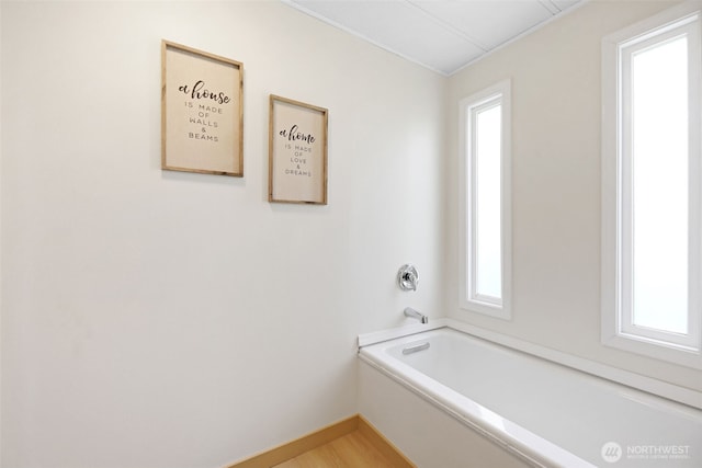 1405 226th St NW, Silvana, WA 98287 - full bathroom with plenty of natural light, wood finished floors, a bathtub, and baseboards