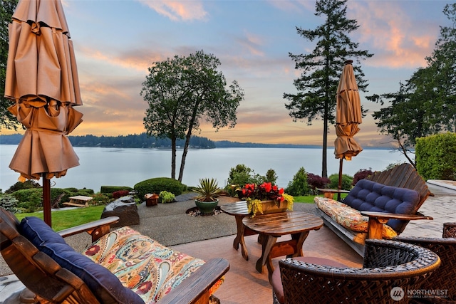 4825 Bayshore Ln NW, Olympia, WA 98502 - patio terrace at dusk featuring a water view and a patio