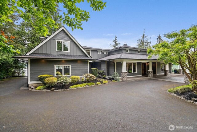 4825 Bayshore Ln NW, Olympia, WA 98502 - craftsman-style house with covered porch, board and batten siding, and driveway