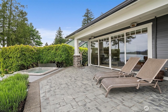 4825 Bayshore Ln NW, Olympia, WA 98502 - view of patio / terrace featuring an outdoor hot tub