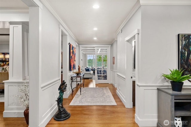 4825 Bayshore Ln NW, Olympia, WA 98502 - hall with a decorative wall, light wood-style flooring, recessed lighting, ornamental molding, and a wainscoted wall