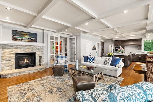 4825 Bayshore Ln NW, Olympia, WA 98502 - living area featuring wood finished floors, coffered ceiling, a fireplace, recessed lighting, and beamed ceiling