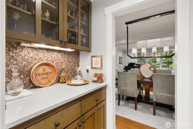 4825 Bayshore Ln NW, Olympia, WA 98502 - bar featuring tasteful backsplash and light wood-style flooring
