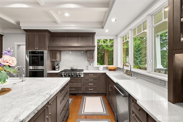 4825 Bayshore Ln NW, Olympia, WA 98502 - kitchen with appliances with stainless steel finishes, dark wood finished floors, a sink, tasteful backsplash, and recessed lighting