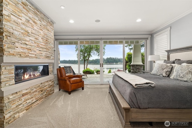 4825 Bayshore Ln NW, Olympia, WA 98502 - carpeted bedroom featuring a water view, access to outside, ornamental molding, a stone fireplace, and recessed lighting