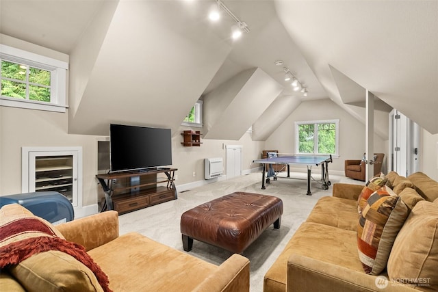 4825 Bayshore Ln NW, Olympia, WA 98502 - carpeted living room with track lighting, baseboards, and vaulted ceiling