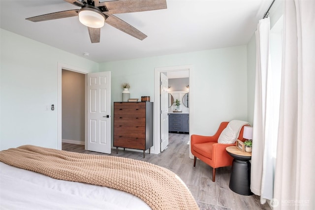 7117 Axis St SE, Lacey, WA 98513 - bedroom with wood finished floors, a ceiling fan, and ensuite bathroom