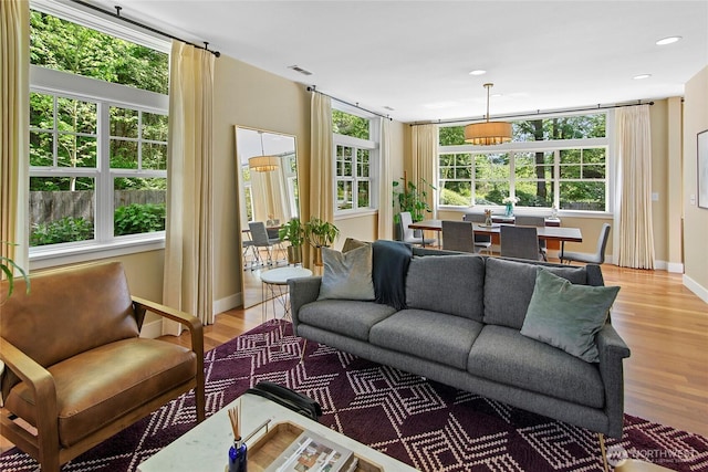 301 Weaver Rd NW, Bainbridge Island, WA 98110 - living area with light wood finished floors, baseboards, and recessed lighting