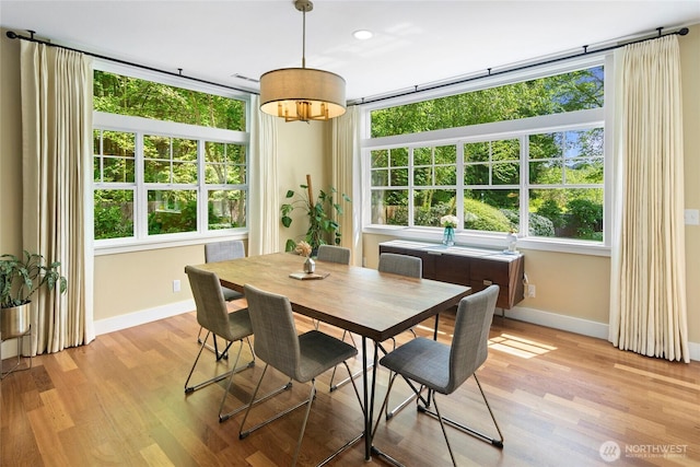 301 Weaver Rd NW, Bainbridge Island, WA 98110 - dining space featuring healthy amount of natural light, baseboards, light wood-style floors, and recessed lighting