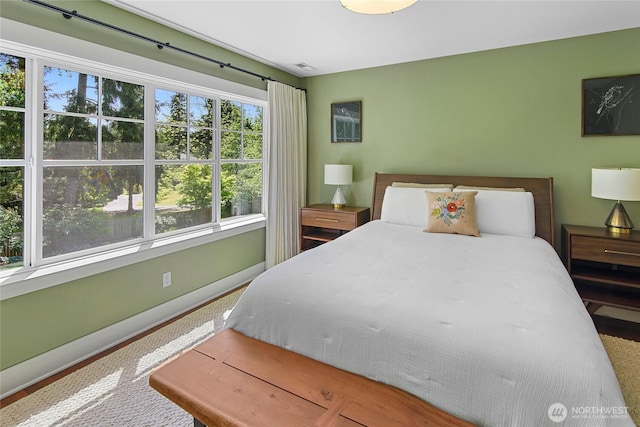 301 Weaver Rd NW, Bainbridge Island, WA 98110 - bedroom featuring baseboards