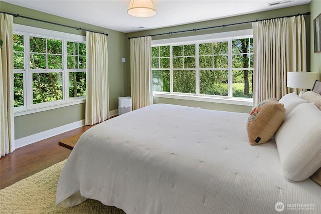 301 Weaver Rd NW, Bainbridge Island, WA 98110 - bedroom featuring wood finished floors and baseboards